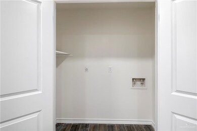 Laundry area with washer hookup and electric dryer hookup