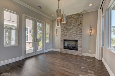 Unfurnished living room with french doors, dark wo