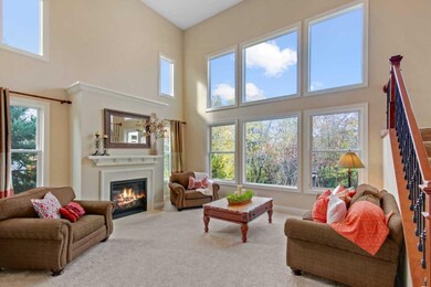 Grand two story great room with wall of of windows
