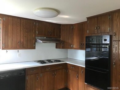 Kitchen has frig, dishwasher and built in oven, el