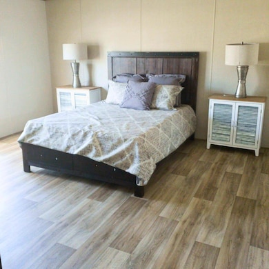 Bedroom featuring wood finished floors