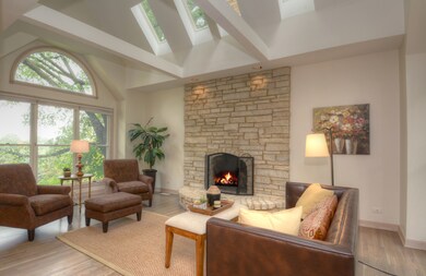 This room has it all - vaulted ceiling, wrapped be