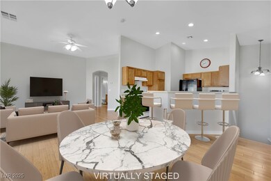 Virtually Staged - Great room with arched walkways