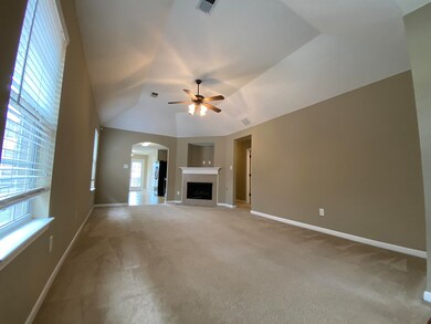 Unfurnished living room with carpet floors and cei