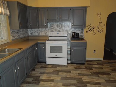 new flooring -refinished cabinets
