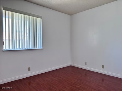 Empty room with wood finished floors and a texture