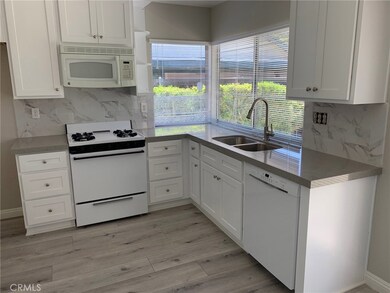 Upgraded kitchen with quartz counters.