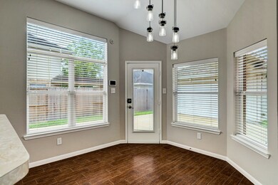 This breakfast nook with its abundance of windows is a retreat that nurtures the spirit and brightens the start of any day.