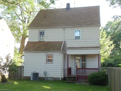 BACK VIEW OF HOME WITH A SMALL PORCH FROM THE DINI