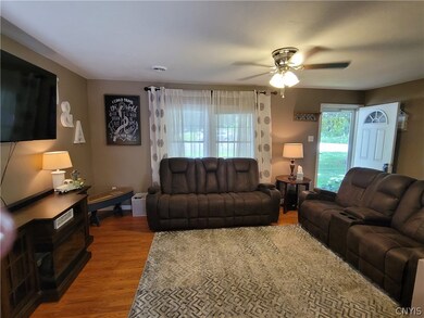 Laminate hardwoods & a big new window in the Livin