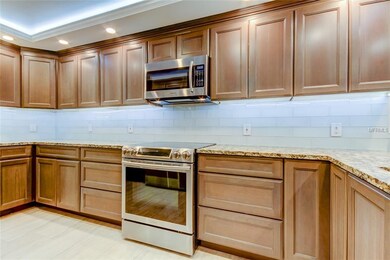 Beautifully updated kitchen, with wood cabinetry, 