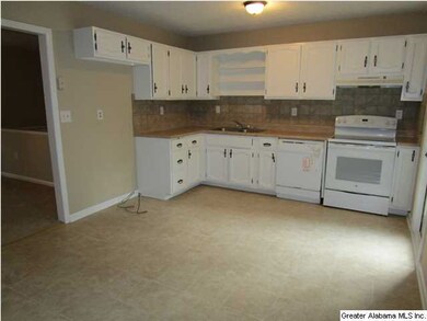 KITCHEN AND EATING AREA ARE OPEN TO LIVING ROOM