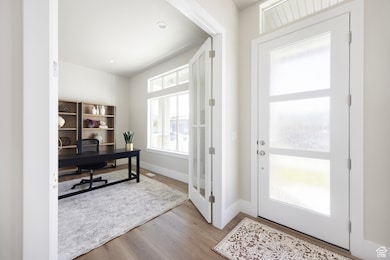 Office space featuring wood finished floors and baseboards