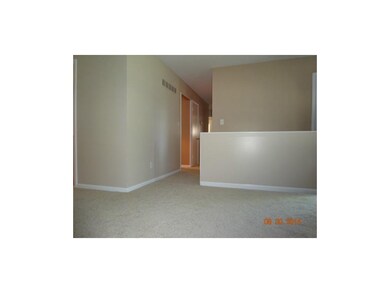 Hall view and area leading downstairs.