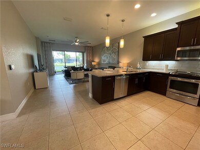 Kitchen with stainless steel appliances, open floo