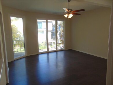 Wall of windows floods the living room with light.