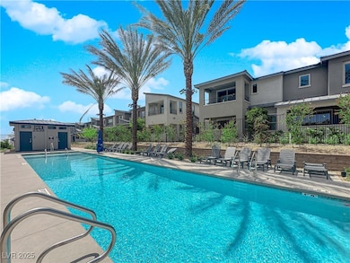 Community pool with a residential view and a patio