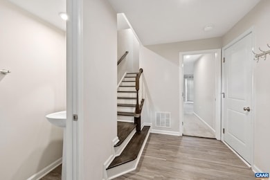 Step into the welcoming foyer of this end-unit tow