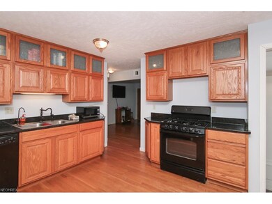 Updated kitchen with classic oak paneled cabinets 