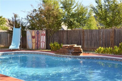 In ground pool with fountain & slide!