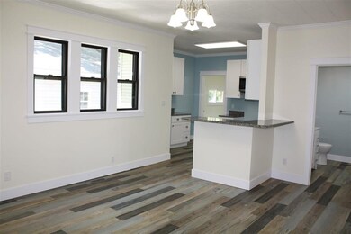 Looking toward the breakfast bar and the kitchen