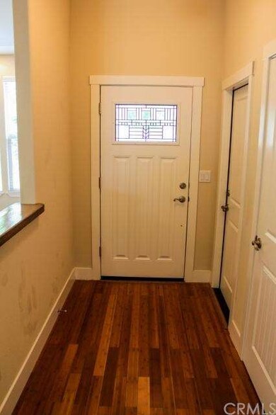 Entry.  Front door has beautiful, inviting window.