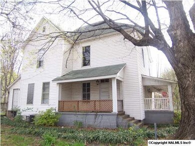 This home was once used as a duplex. It is in a great location on a large corner lot with mature trees.