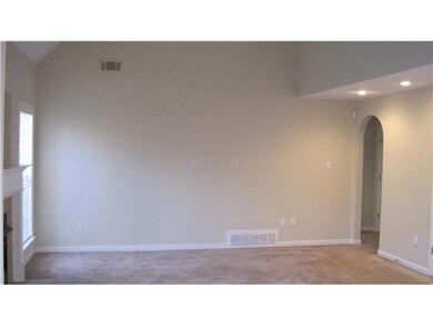 Great room has a gas fireplace, archways and lots of space.  The balcony overlooks into this area.