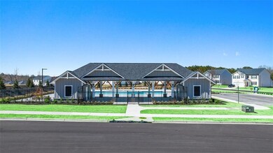 View of front of house featuring fence, a front la