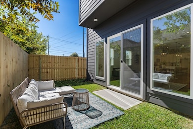 Private fenced in yard is a rarity in this neighborhood, accessed through sliding doors off the first floor living area that even includes a custom screen!