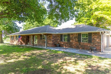 Front porch is partially covered. Gutters with gut