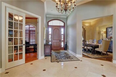 Elegant entry featuring beautiful marble floors.