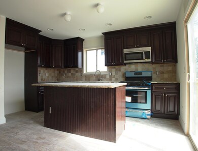 (5) Eat In Kitchen with Sliders to Deck.