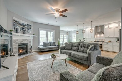Open floor plan with warm hardwood floors and lots