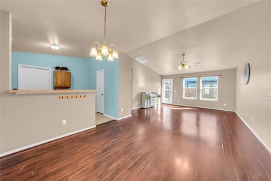 Unfurnished living room with baseboards, vaulted c