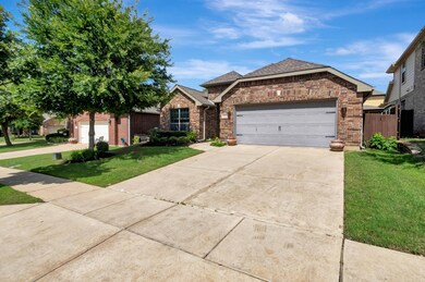 Ranch-style home with a garage and a front yard