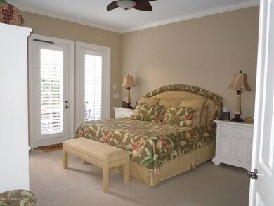 Master Bedroom overlooking pool area