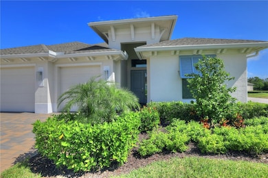 Prairie-style house featuring stucco siding, an attached garage, and roof with shingles