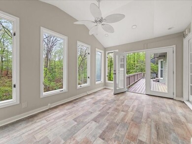 Unfurnished sunroom featuring wood finished floors