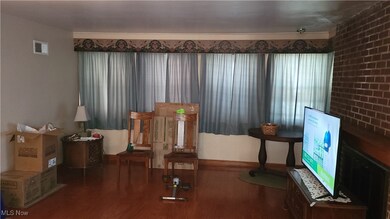 Sitting room featuring wood finished floors and baseboards