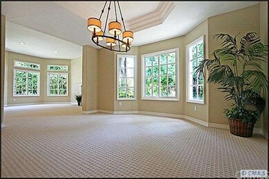 Formal dining room with coffered ceilings.