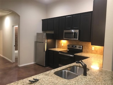 Kitchen featuring appliances with stainless steel