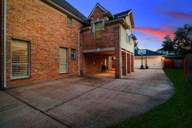 Double drive way leading to the 3 car garage. Easy parking under your porte-cochere for bring items into the house.