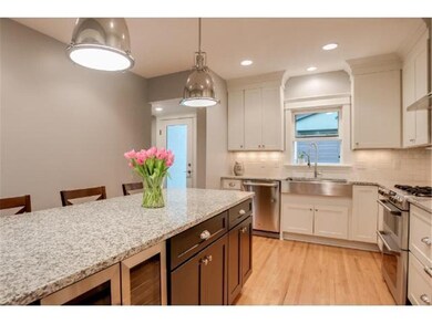 Built-in wine/beverage cooler in center island.