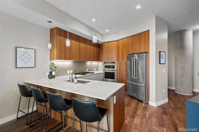 Upgrades galore in the kitchen with Italkraft cabinetry, a five burner range, and quartz countertops