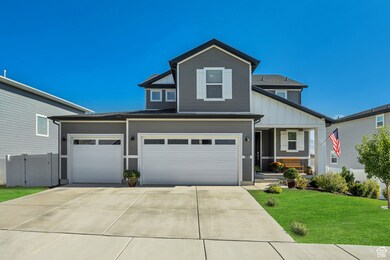 Traditional-style house with board and batten siding, concrete driveway, covered porch, a garage, and a shingled roof
