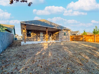 Rear view of house featuring a patio