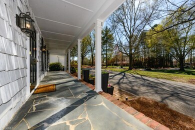 Love this slate rocking chair front porch and circle drive