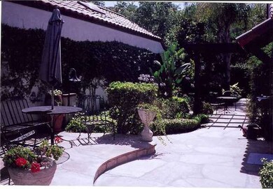 Expansive backyard with flagstone.