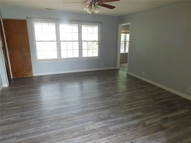 The entire house has new laminate flooring throughout except for the kitchen and bathroom, which has ceramic tile.